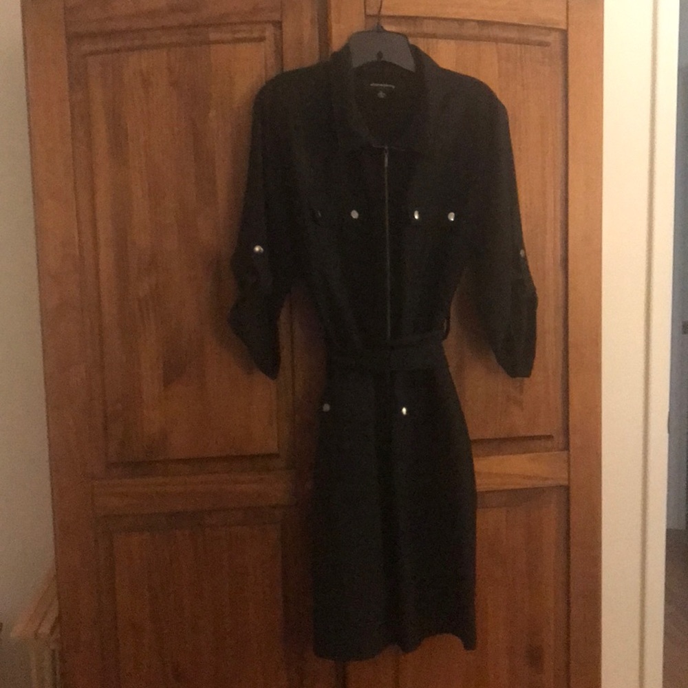 Black dress with button and zipper. With belt